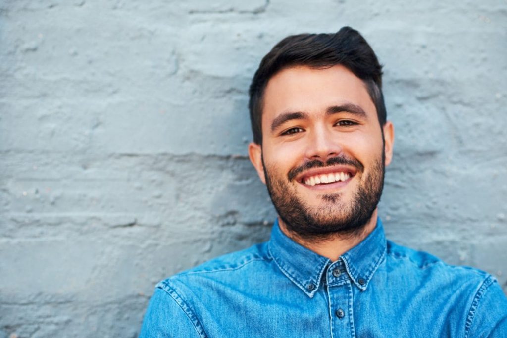 The world need more of your smile. Smiling man. Black hair. White teeth. Black beard.