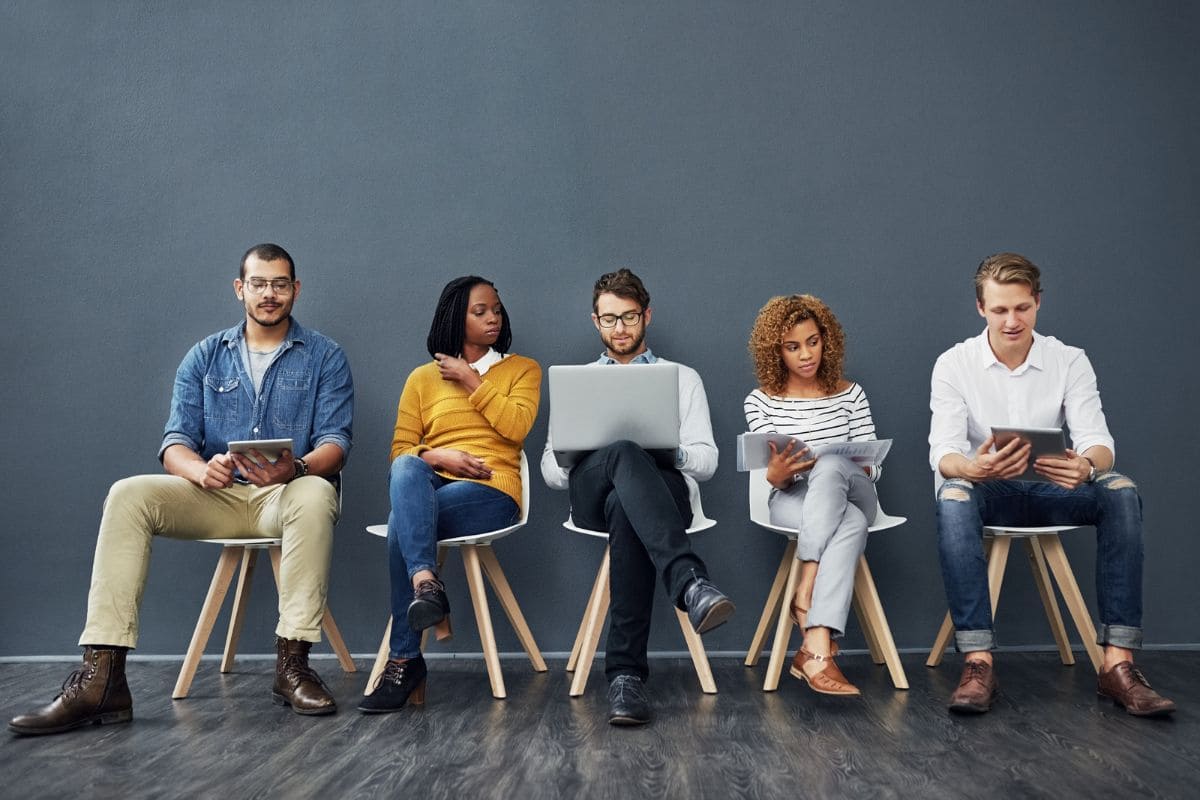 It's hiring season, five people sitting on chairs