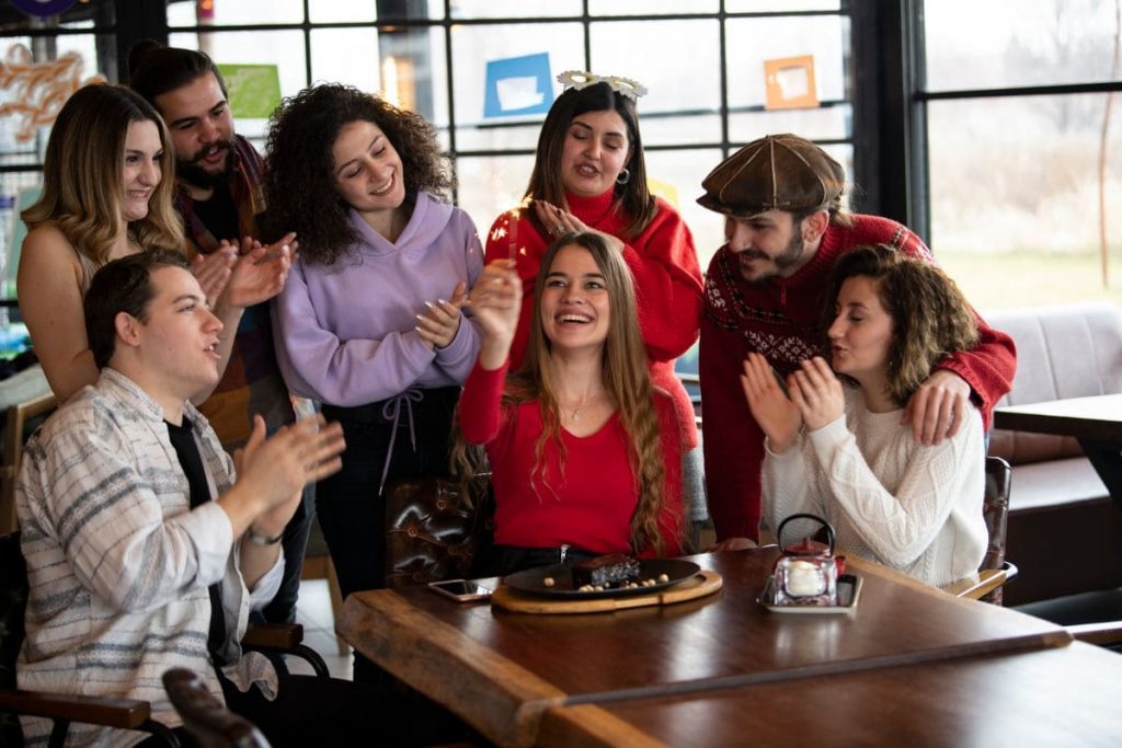 Young colleagues celebrate birthday at restaurant