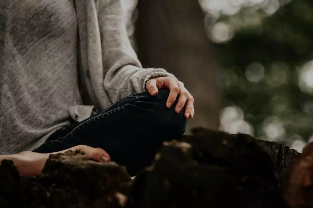 Be still, being misunderstood, person siitng on ground, hand over knee