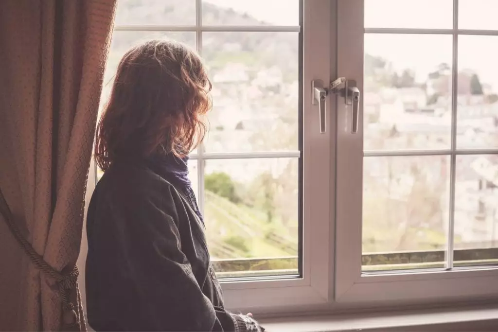 Woman looking out the window
