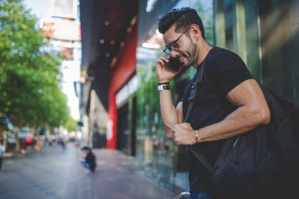 Man talking on phone and smiling