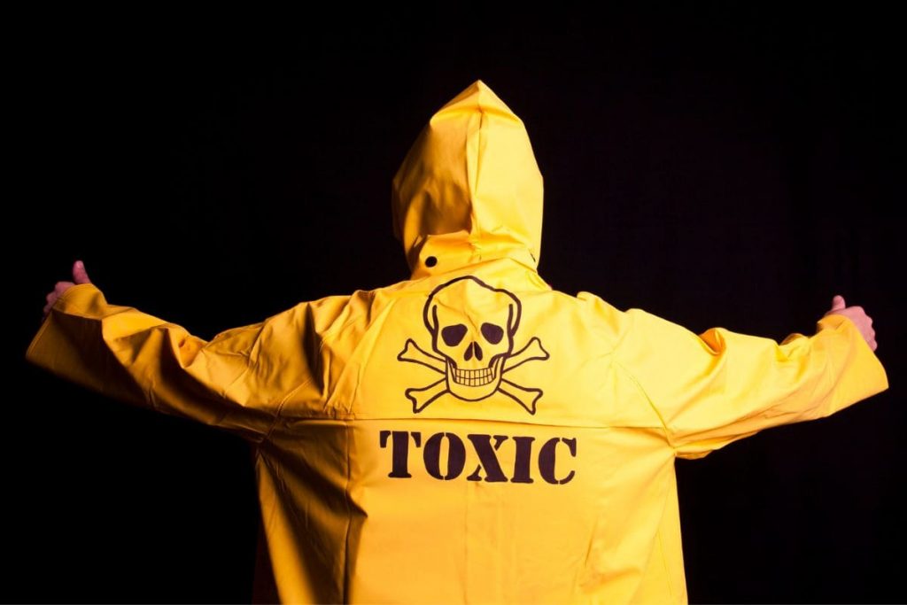 Person wearing a yellow jacket with the caption toxic