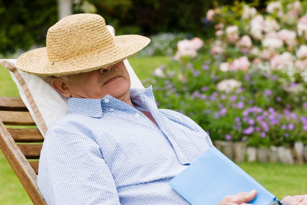Man napping in lounge chair