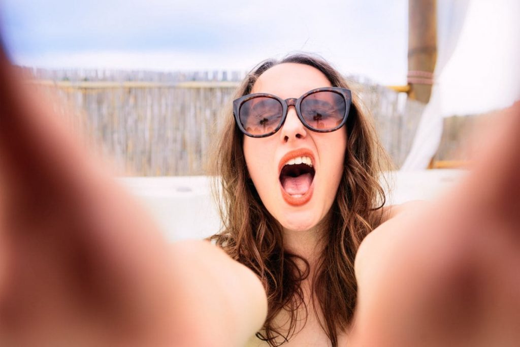 Woman making an extrovert selfie