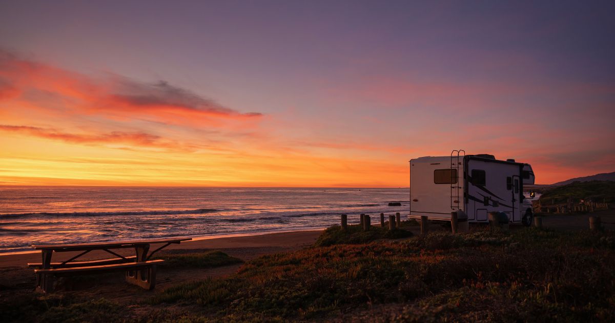 Scenic pacific ocean sunset from a camper van class c motorhome